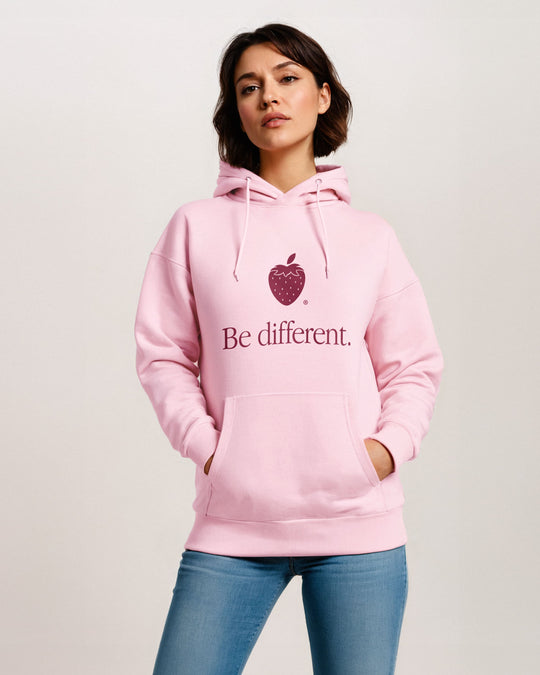 Be Different pink hoodie on model, strawberry icon