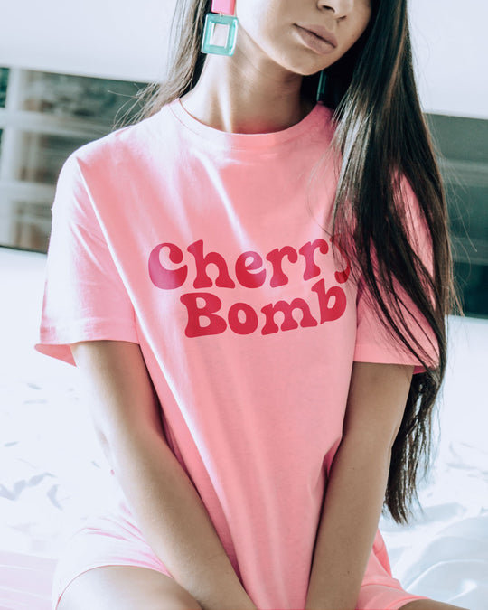 Cherry Bomb t-shirt in light pink, worn by a model
