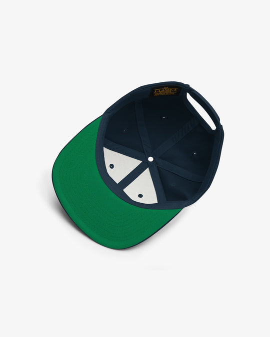 Cultural snapback in navy blue, inside view with green undervisor and navy interior panels
