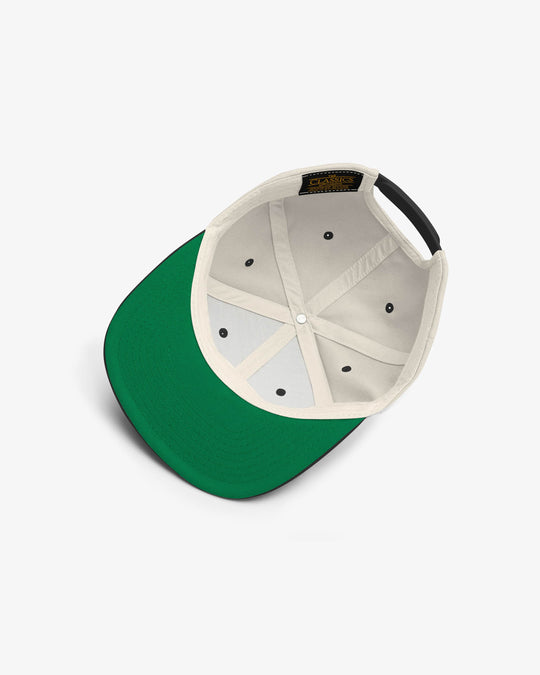 Cultural snapback in natural and black, inside view with green undervisor and label