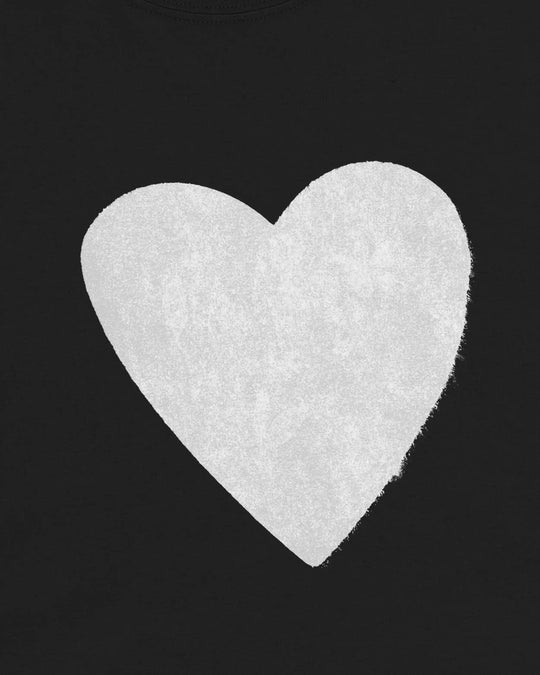 Close-up of the washed white heart print on the black t-shirt