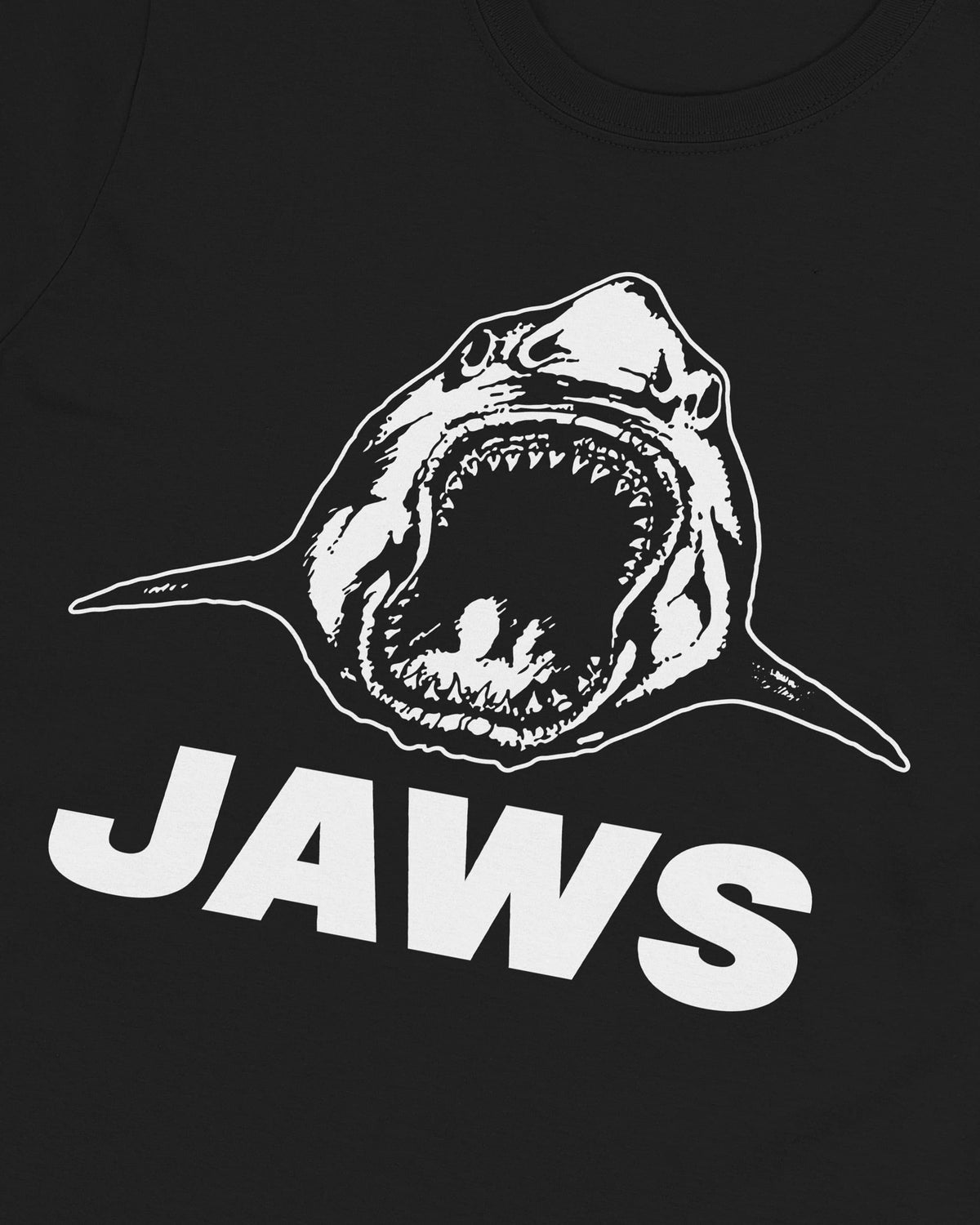 Close-up of the Jaws print on the black t-shirt, illustrated shark with open jaws