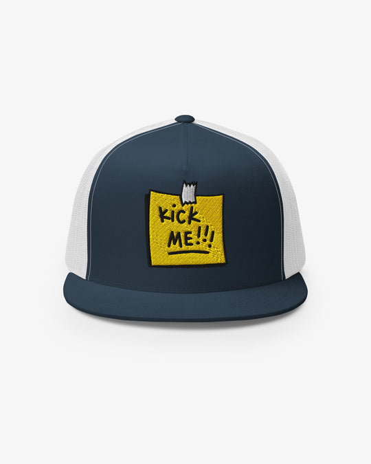 Navy and white trucker cap with embroidered Kick Me!!! sticky-note graphic, front view