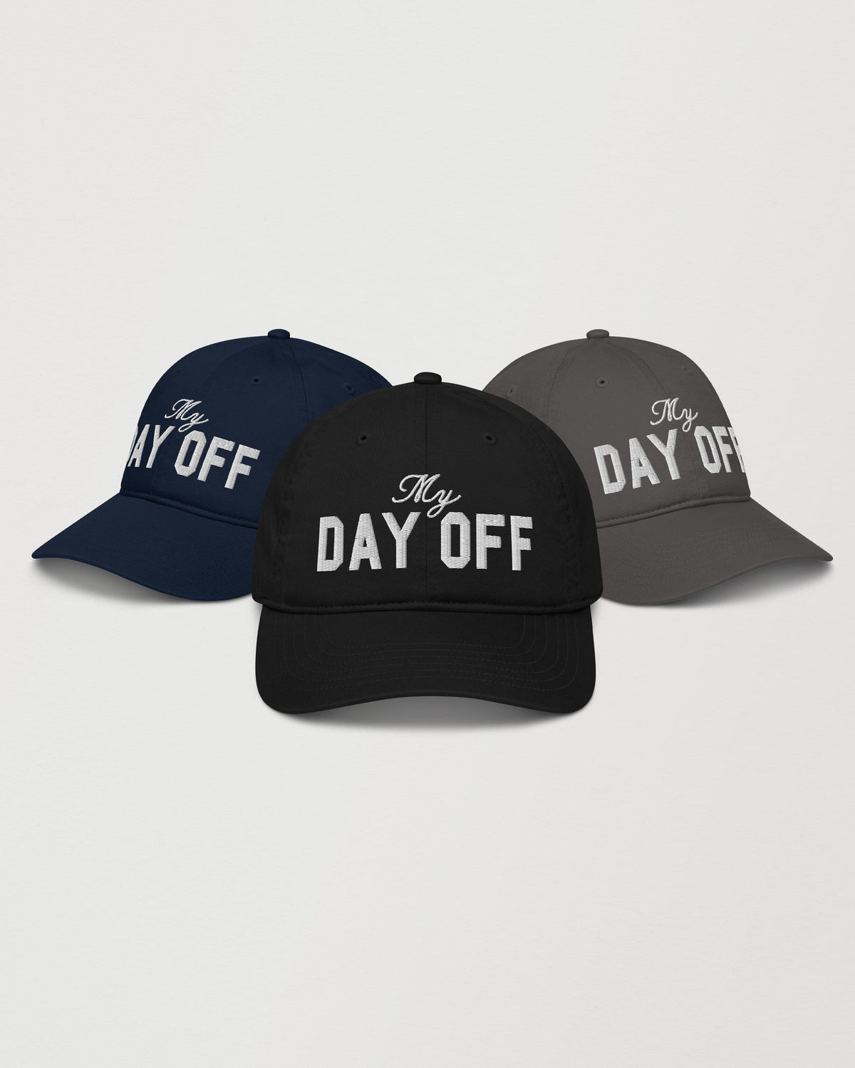My Day Off embroidered cap by Wearrs, shown in black, pacific, and charcoal