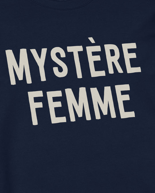 Close-up of cream MYSTÈRE FEMME lettering printed on navy sweatshirt fabric