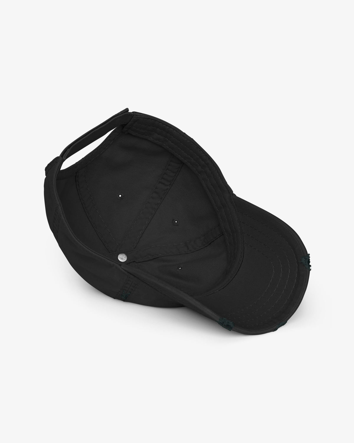 Inside of black distressed dad hat showing seamed crown, sweatband and eyelets