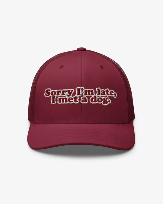 Sorry I'm Late, I Met A Dog embroidered trucker hat, cranberry, front view