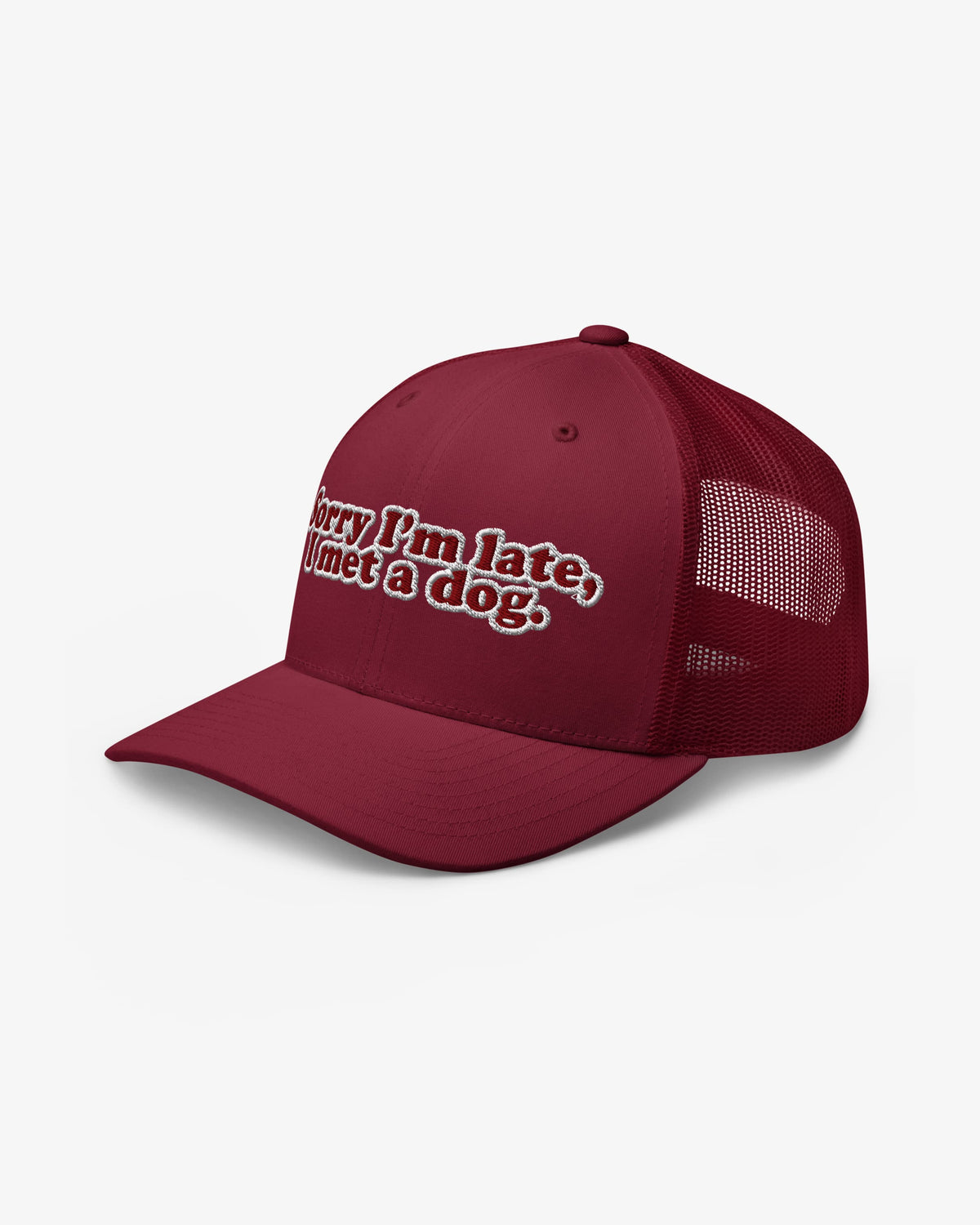Sorry I'm Late, I Met A Dog embroidered trucker hat, cranberry, front three-quarter angle view