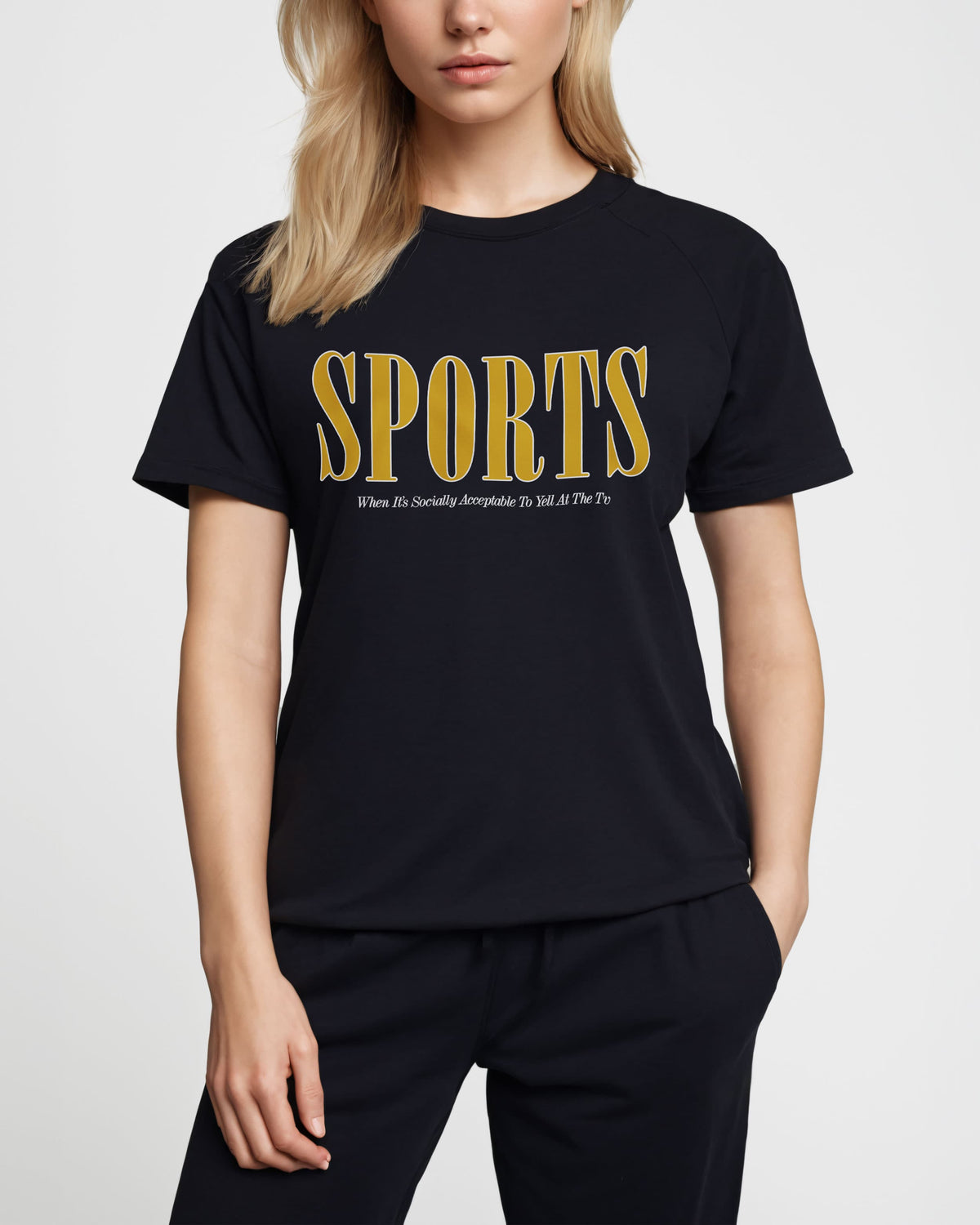 Sports t-shirt with yellow "SPORTS" wordmark on a dark t-shirt, worn by a model